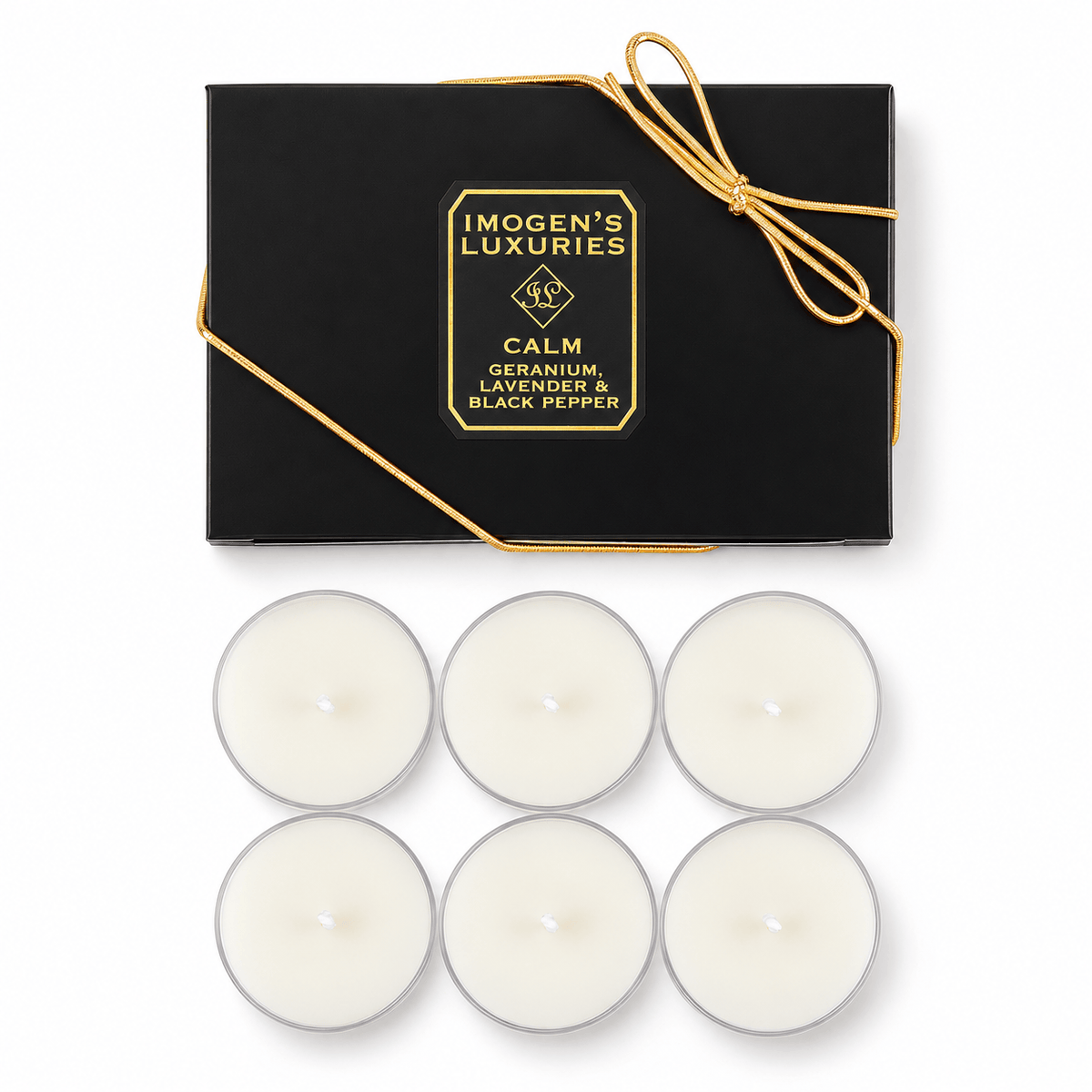 Six white tea light candles arranged below a black gift box with gold lettering and a gold ribbon. The box reads 'IMOGEN'S LUXURIES' and 'CALM GERANIUM, LAVENDER & BLACK PEPPER'.