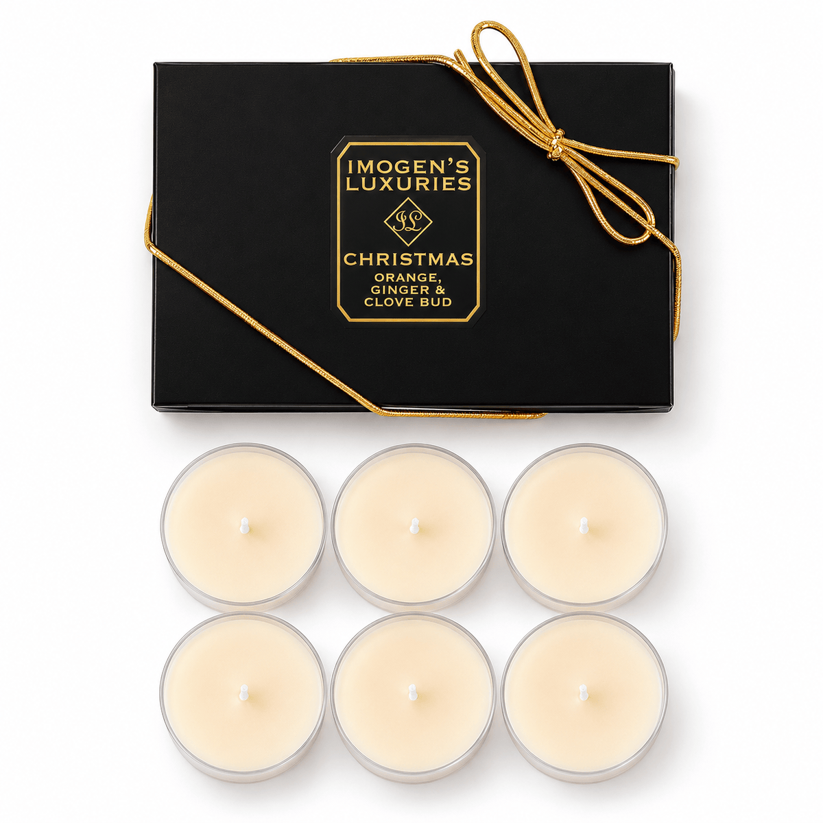 6 Christmas Tea-light candles presented in polycarbonate clear cups and in from t of a black and gold box with a gold bow which says "Imogen's Luxuries" "CHRISTMAS"