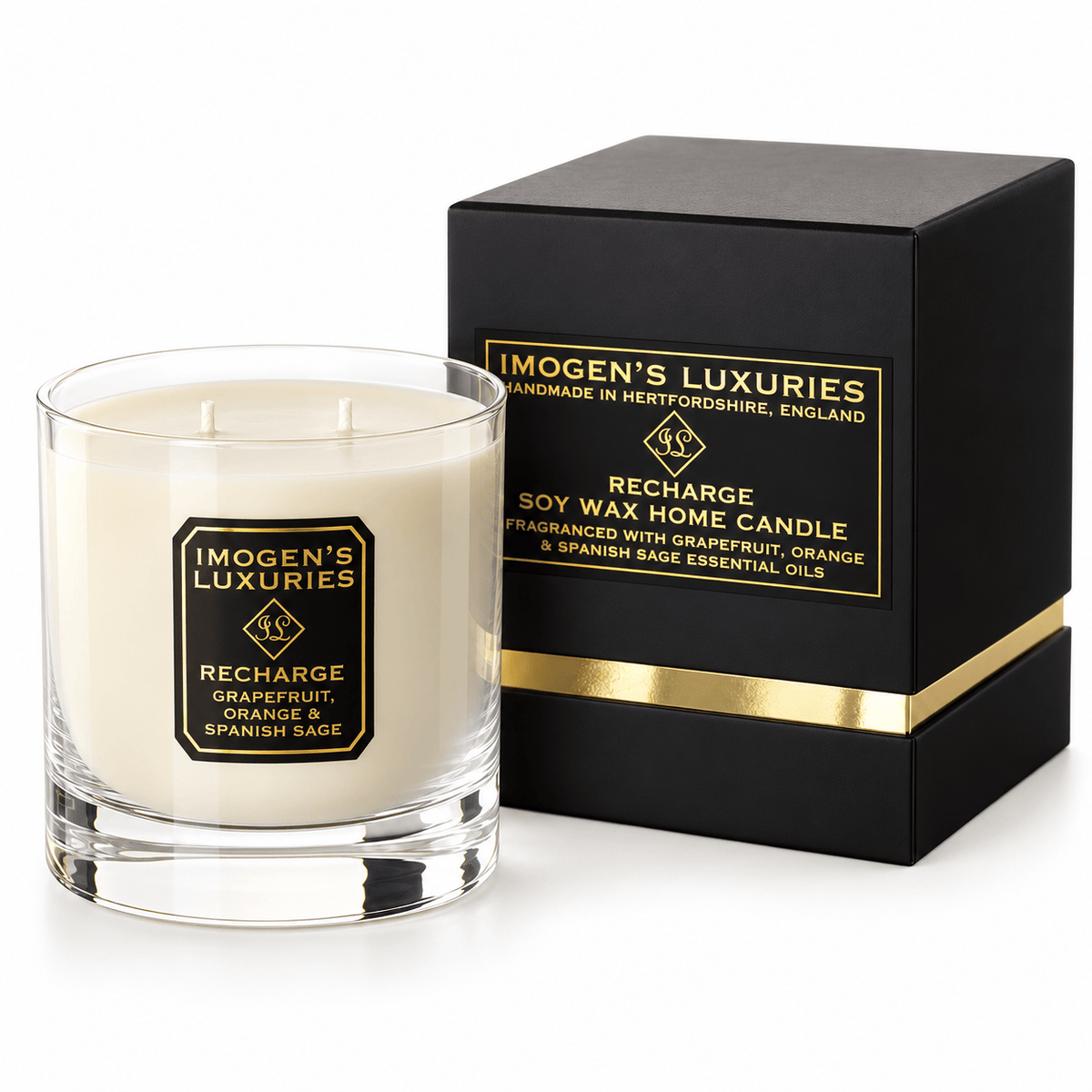 Cream coloured natural wax candle in glass container. Candles is scented with Grapefruit, Orange & Spanish Sage Essential Oils. On the glass container is a black and gold label saying "Imogen's Luxuries" "Recharge". The candle sits by a solid black and gold shoulder box with a black and gold label saying "Handmade Natural Wax Candle fragranced with pure essential oils.