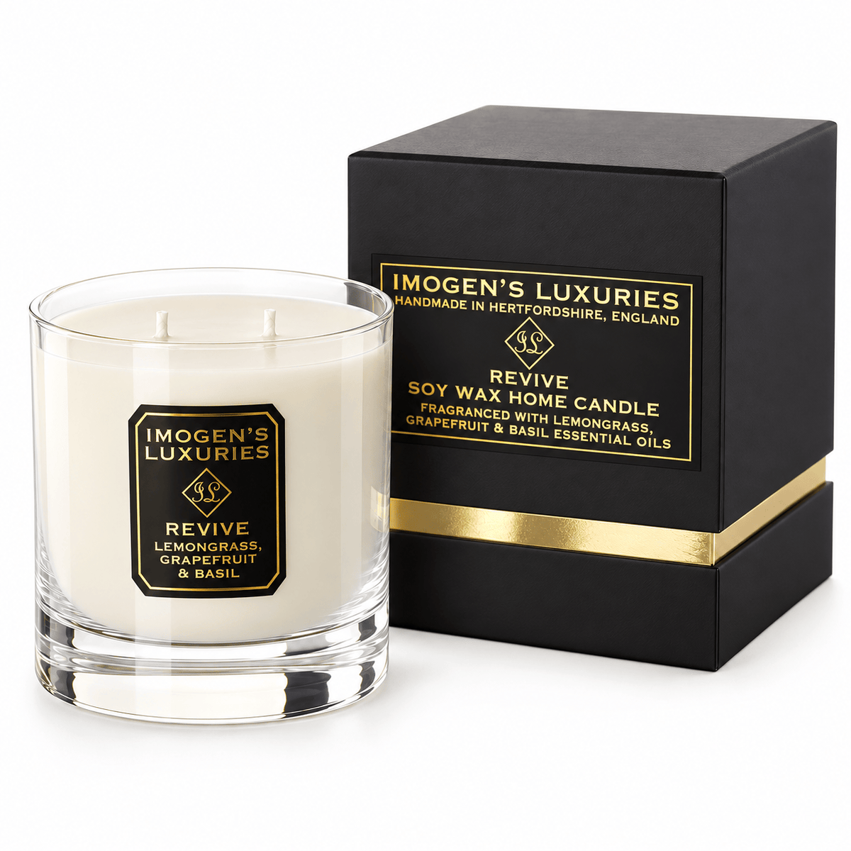 Cream coloured natural wax candle in glass container. Candles is scented with Lemongrass, Grapefruit & Basil Essential Oils. On the glass container is a black and gold label saying "Imogen's Luxuries" "Revive". The candle sits by a solid black and gold shoulder box with a black and gold label saying "Handmade Natural Wax Candle fragranced with pure essential oils.