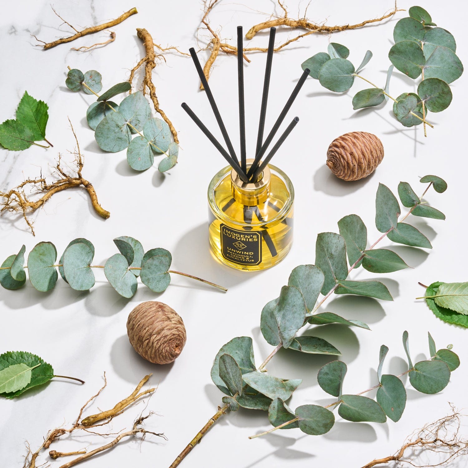 Unwind is a sumptuous and masculine blend of Patchouli, Cedar and Eucalyptus essential oils. Long lasting our Unwind reed diffuser is 100ml and includes 6 thick black reeds. Available with or without gift box. Handmade by Imogen's Luxuries, Berkshire, England