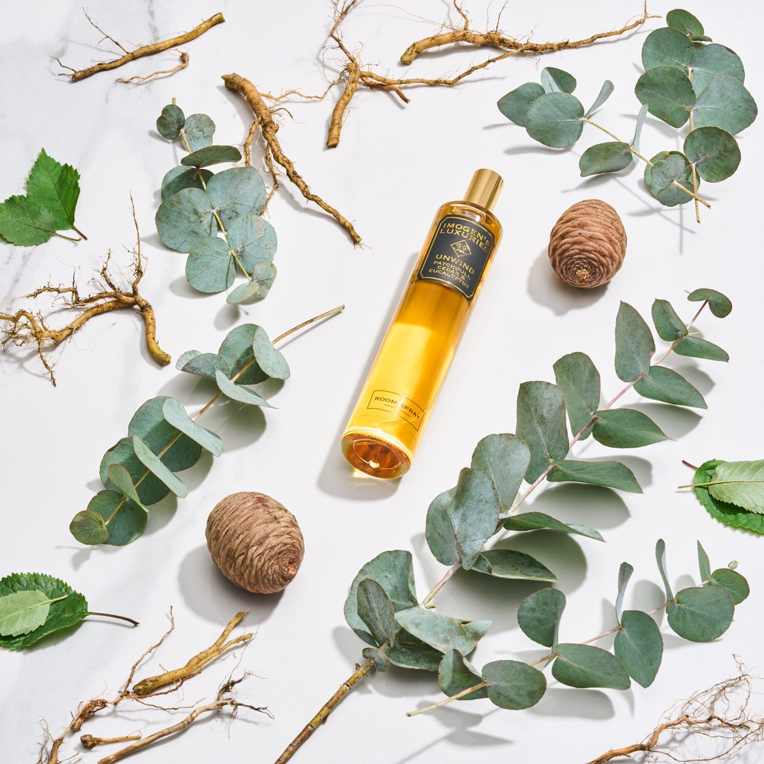 Unwind room spray is generously scented with Patchouli, Cedar and Eucalyptus essential oils. Masculine and sumptuous woody scent. Handmade Imogen's Luxuries Berkshire England. Large 100ml size in glass bottle with perfume atomiser to create a fine scented mist