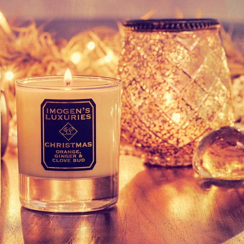 Christmas Candle burning. Handmade with 135g Soy wax. Fragranced with Orange, Cinnamon, Clove & Ginge Essential Oils.