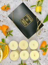 Recharge Tea lights scented with Grapefruit, Orange and Spanish Sage EssentialOils. Handmade with natural wax and free from paraffin wax and synthetic ingredients. Cruelty free and vegan. Pack of 6 in clear acrylic recyclable cups. Cruelty free and vegan. Imogen's Luxuries, Berkshire