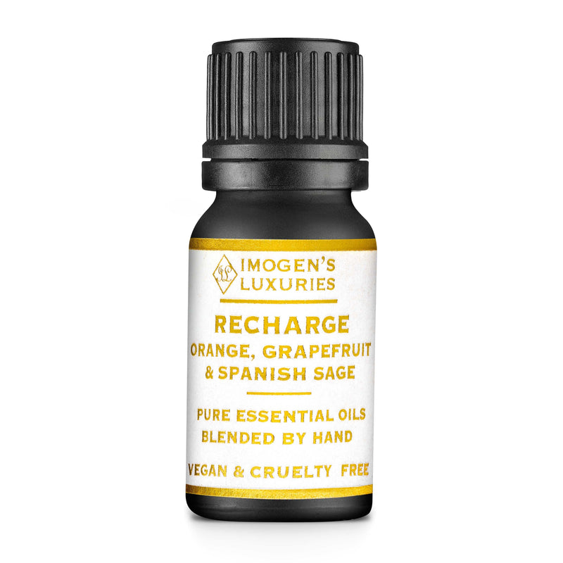 Recharge is an all natural and 100% pure blend of Grapefruit, Orange & Spanish Sage Essential Oils.  Blended to harness the aromatherapy properties, these uplifting citrus essential oils are a natural way to boost your mood. 10ml black glass bottle with white & Gold label. Imogen's Luxuries, Berkshire, England. Natural, vegan & cruelty free