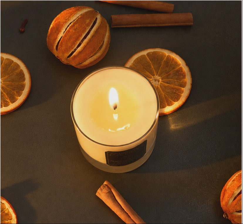 5 second video of luxury Christmas soy wax 1 wick candleburning with a flickering flame. Candle is highly scented with our award winning blend of Orange, Cinnamon, Clove and Ginger Essential Oils. Handmade in Berkshire by Imogen's Luxuries, natural, vegan and cruelty free.