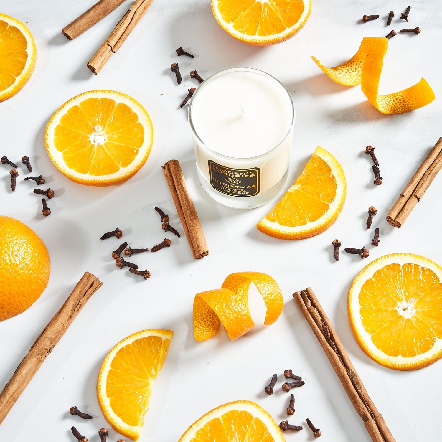 Christmas 1 wick candles is handmade with natural wax and generously scented with Orange,Cinnamon, Clove and Ginger essential oils. Wonderfully festive and beautifully gift boxed. Natural, vegan and cruelty free. Handmade by Imogen's Luxuries, Berkshire. 140g wax weight