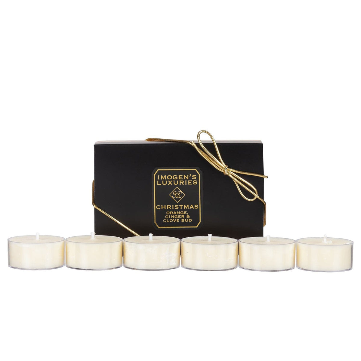 Pack of 6 Christmas soy wax tea light candles highly scented with Orange, Cinnamon, Clove & Ginger Essential Oils. Box of 6 x 20g in clear acrylic cups. Presented in black and gold gift box with a bow.