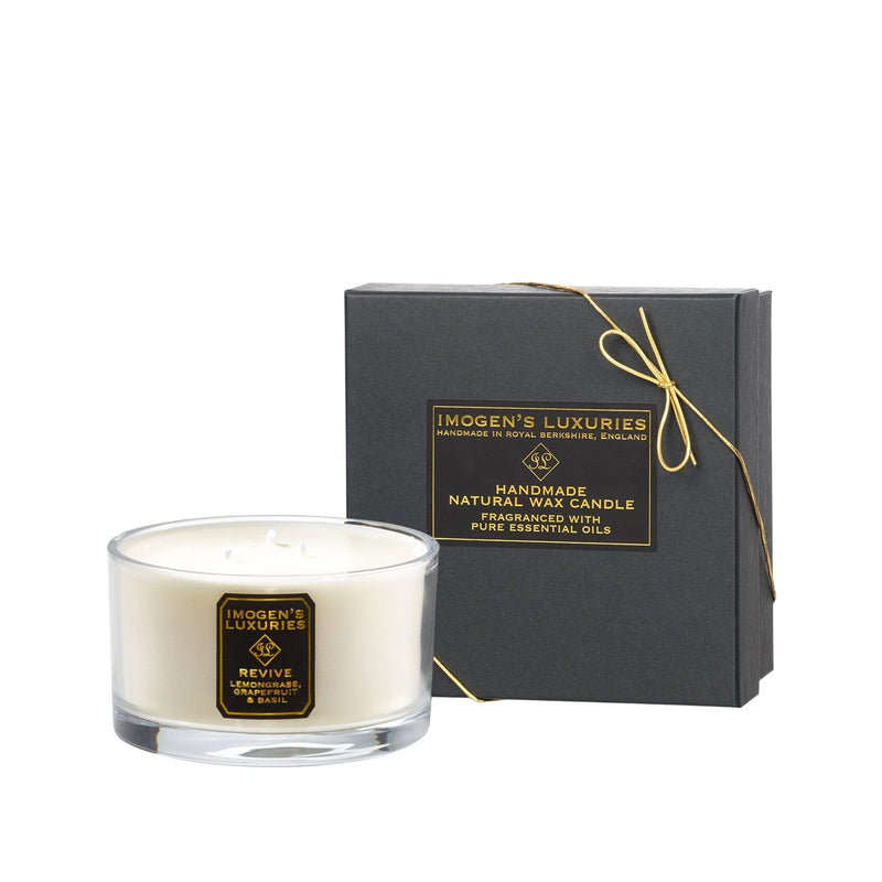 Revive 3 wick aromatherapy candle is strongly scented with pure essential oils of Lemongrass, Grapefruit and Basil.  scented candle is handmade with natural eco friendly rapeseed and coconut wax. An uplifting, crisp, citrus candle. Large 500g wax weight in a luxury Gift Box. Handmade by Imogen's Luxuries, Berkshire, England