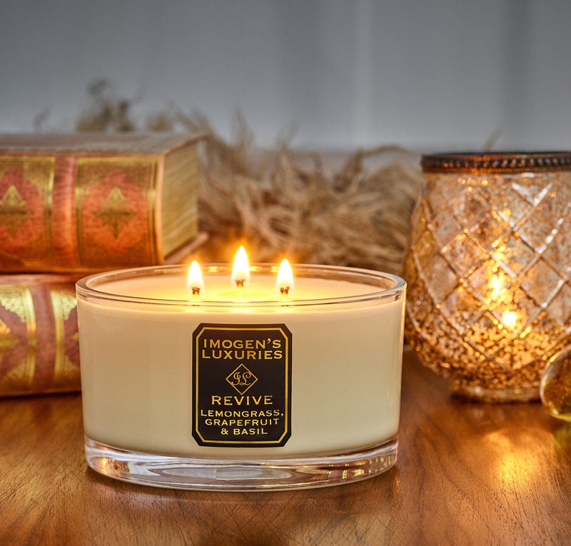 Revive luxury 3 wick aromatherapy candle is strongly scented with pure essential oils of Lemongrass, Grapefruit and Basil.  Handmade with natural eco friendly rapeseed and coconut wax. An uplifting, crisp, citrus candle. Large 500g wax weight in a luxury Gift Box. Imogen's Luxuries, Berkshire, England